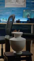 Empty artwork studio space with easel and white canvas for professional artist. Nobody in workshop room but art tools, instruments, equipment for creative design and craft decorations