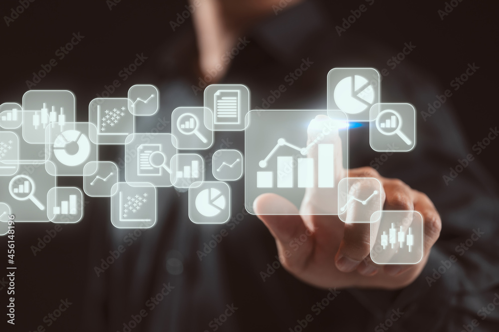 Fototapete Big data analytics and business intelligence (BI) concept. Businessman with chart and graph icons on a digital screen interface