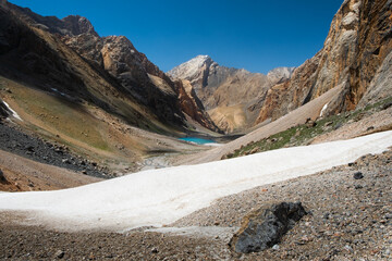 Fann Mountains in Tajikistan.  Beautiful mountain view with Lake Verchnoe Allo in the background. On the descent to Bolshoi Allo Lake