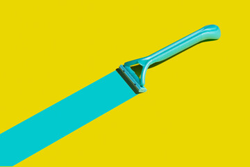 Razor for hair removal, creativity, trend. The concept of body care. Hard shadows, side view.
