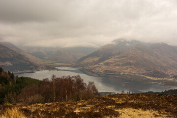 The Five Sisters of Kintail mountain range shrouded in mist from Bealach Ratagain