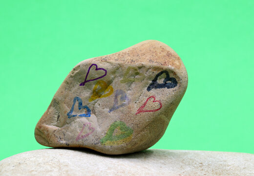 colorful heart shape drawn on stone

