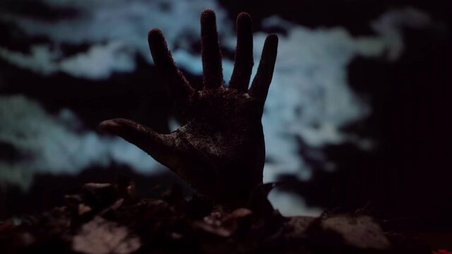 Zombie hand coming out of the ground
