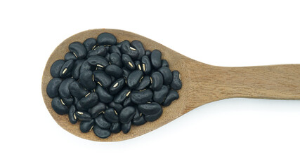 Black beans raw in wooden spoon, Organic grains food, Isolated on white background
