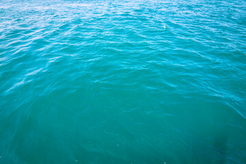 Turquoise wavy sea background. Sea texture.