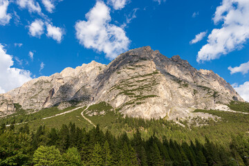 Fototapeta premium Mountain range of the Pomagagnon (2450 m.), Dolomites, UNESCO world heritage site, Italian Alps, near the small village of Cortina D’Ampezzo, tourist resort in Belluno province, Veneto, Italy, Europe.