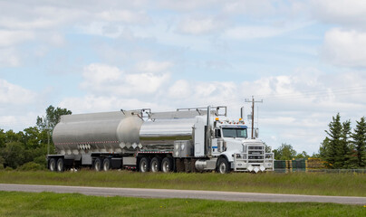 Heavy cargo on the road. A truck hauling freight along a highway