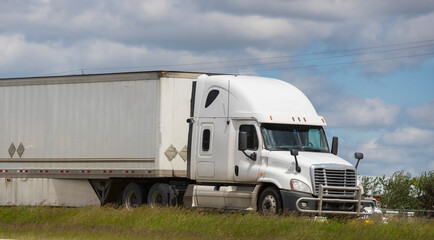 Heavy cargo on the road. A truck hauling freight along a highway