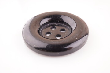 black button for clothes on a white background