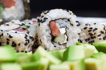 sushi made from white rice, trout and avocado