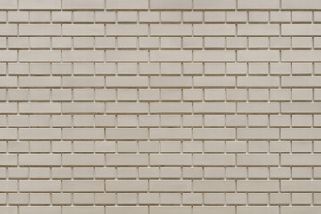 Luxury beige brick wall texture background. Close up of stylish brick wall.