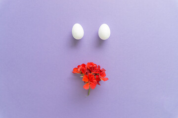 Creative modern concept of red daisy flower and white eggs.