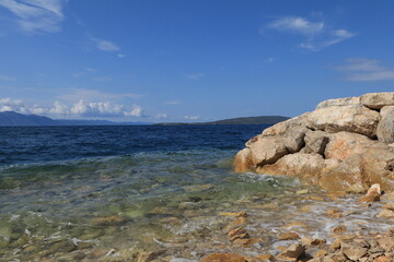 Adriatic sea coast in summer with rocks and water
