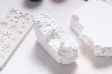 White modeling soft clay for hobby and craft, on wooden table