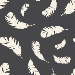 Fototapeta na wymiar Bird light feathers fly on a dark background. Seamless pattern for modern fabrics, trendy textiles, decorative pillows. 