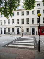 London street crossing. A zebra crossing for pedestrians across a cobbled road in the Fitzrovia district of Central London. - 456165314