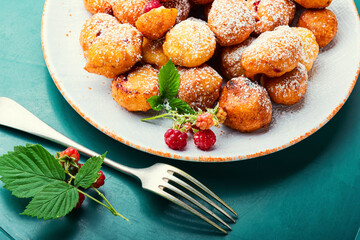 Curd donuts with raspberries