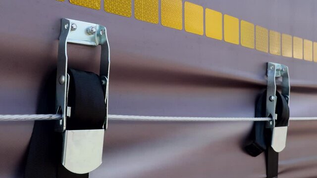 the cargo and the body are held by tension safety belts