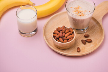 Fresh made Banana smoothie on pink background