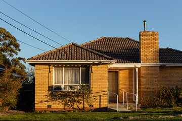 Cozy brick cottage in suburb.