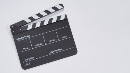 Clapperboard or movie slate use in video production, film and  cinema industry. It's black color on white paper background. - obrazy, fototapety, plakaty