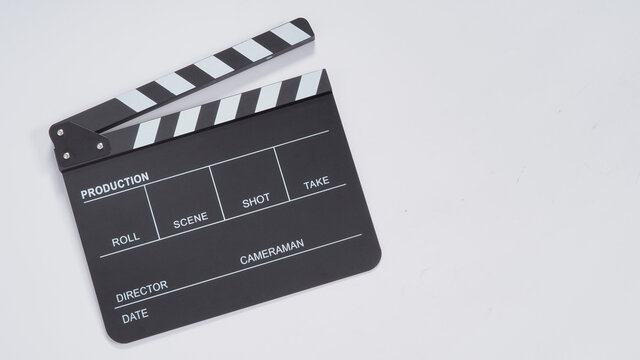 Clapperboard or movie slate use in video production, film and  cinema industry. It's black color on white paper background.