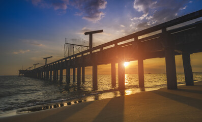 Fototapeta na wymiar Silhouette long bridge and sky sea scape.