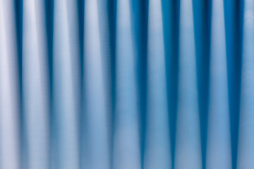 Abstract scene of blurry blue sticks in dark and light tone.