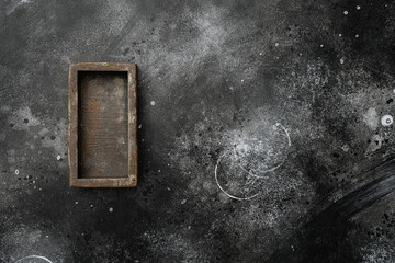 Empty wooden box with copy space for text or food, top view flat lay , on black dark stone table background