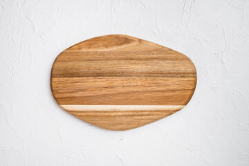 Pine wooden cutting board, on white stone table background, top view flat lay , with copy space for text or your product