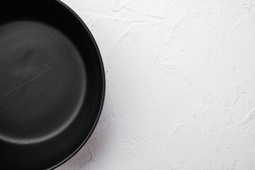 Empty black bowl, with copy space for text or food, with copy space for text or food, top view flat lay , on white stone table background