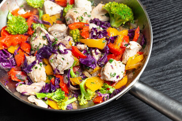 turkey meat and variety of vegetables cooked on a stainless steel pan