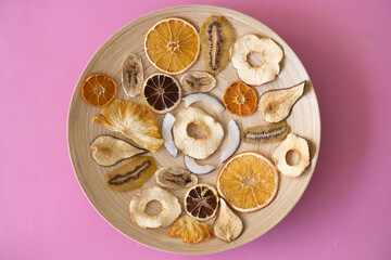 Healthy vitamins in dried fruits Diet food Wooden plate for food on the background