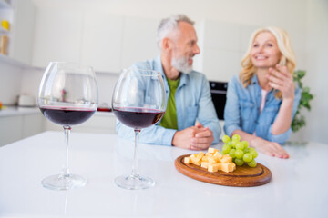 Photo of two married people talking with each other drink wine glass eat appetizer cheese and grape...