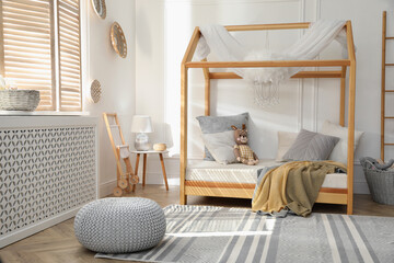 Stylish child room interior with house bed