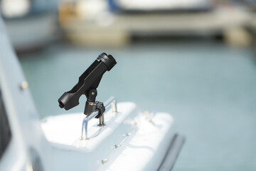 Fishing accessories - black rod holder on a board