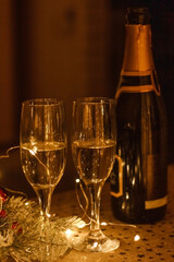 New Year Eve celebration with bottle and glasses of champagne