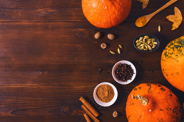 Hokkaido pumpkins next to organic spices cinnamon