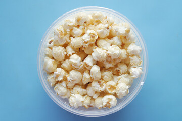  popcorn in a bowl on wooden desk