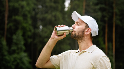 Young golfer drinking water from a bottle - 456188192