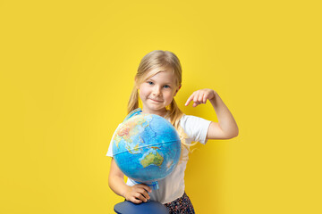 girl showing finger yellow background