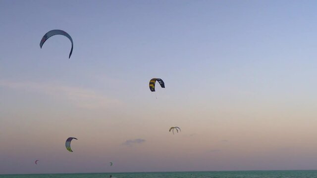 Kite boarding in Paje beach and People at the beach, Zanzibar, Tanzania, Africa