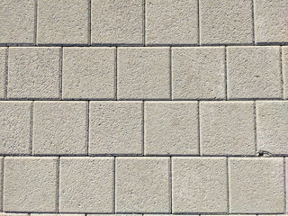 Background and texture of gray color from square paving slabs. Pedestrian street decor.