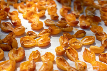 Apricots that have been opened and pitted for sun-drying. dried apricots. close-up. 