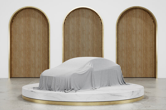 A car covered with cloth on white marble podium with a gold base on the floor and wood feature wall background in luxury studio scene. Modern showroom interior 3d rendering image for product display.