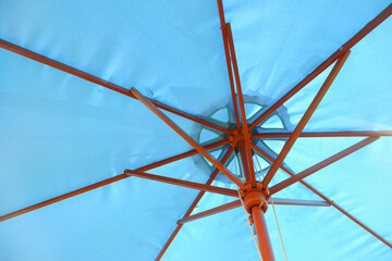 Wooden rod inside umbrella beach