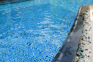 Blue water and edge of swimming pool