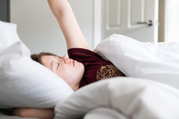 Obraz na płótnie Canvas Sleepy teenager girl in bed