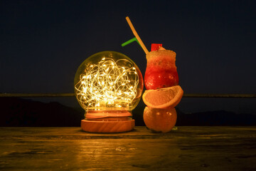 Fairy lights wire in bottle Glass with cocktail drink