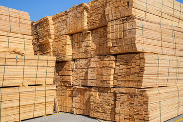Wooden boards, lumber, industrial wood, timber. Pine wood timber stacked at the port site 